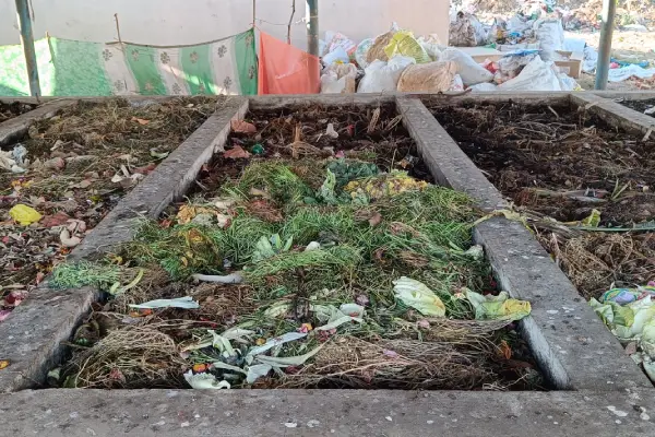 A compost pit where raw garbage is collected and left to decompose in solid Waste Management unit